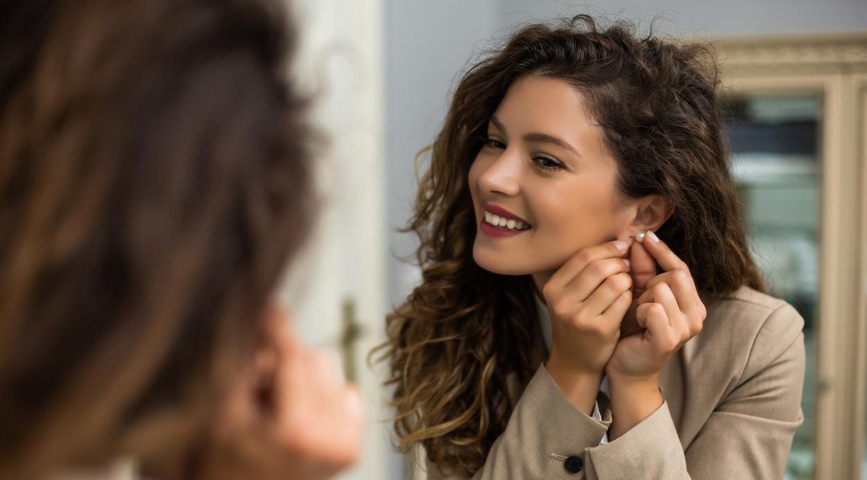 Woman buying diamond earrings